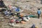 Unidentified poor local Traditional fisherman are living on the beach in the middle of the garbage and cows and goats, under tents