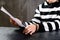 Unidentified prisoner in handcuffs in prison stripped uniform si