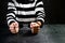Unidentified prisoner in handcuffs in prison stripped uniform si