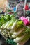 Unidentified produce seller sells fresh vegetables
