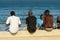 Unidentified Senegalese boys hang out on the coast of the ocean