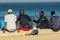 Unidentified Senegalese boys hang out on the coast of the ocean