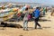 Unidentified Senegalese men walk on the coast of the Atlantic O
