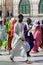 Unidentified Senegalese people in colored traditional clothes w