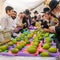 Unidentified shoppers examine citrons, the centerpiece fruit of the Four Species of the Sukkot Festival