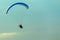 Unidentified skydiver, parachutist on blue sky