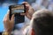 Unidentified spectator uses his cell phone to take images during tennis match at 2019 Australian Open in Melbourne Park