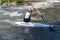 Unidentified sportsman struggling with the flow. in La Seu d`Urgell, Catalonia. Parc Olimpic del Segre