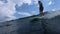 Unidentified surfer rides the ocean wave