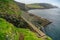 Unidentified tourist crossing the bridge in Mykines island