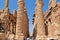 Unidentified tourist near magnificent columns of the Great Hypostyle Hall at the Temples of Karnak ancient Thebes in Luxor, Egypt