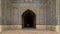 Unidentified tourist stands at the entrance of prayer hall in Vakil Mosque, Shiraz, Iran