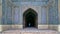 Unidentified tourist stands at the entrance of prayer hall in Vakil Mosque, Shiraz, Iran