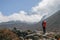 Unidentified tourist trekking in nepal walking from dingboche to chukung within sagarmatha national park on everest base camp