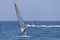 Unidentified Turkish man glides over the waves of the Mediterranean Sea windsurfing