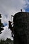 Unidentified wall climber silhouetted