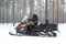 Unidentified woman rides snowmobile in Rovaniemi in the Lapland region of Finland.