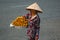 Unidentified woman seller in the old quarter of Saigon