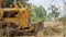 Unidentified worker control Bulldozer to excavator grader removing the ground