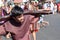 Unidentified young man playing role of thief carrying logs, street drama, community celebrates Good Friday representing the events