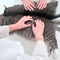 A uniformed doctor examines a cat fur in a white vet clinic