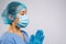 A uniformed doctor prays during the coronavirus outbreak. Emotional stress of an overworked doctor on white background