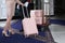 A uniformed doorman picks up a suitcase.The doorman helps the guest who arrived at the hotel to carry her luggage.A doorman in