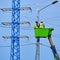 Uniformed electricians repairing electrical wires on a high pole