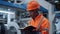Uniformed engineer writing notes at machinery plant. Closeup analyst concept