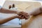 A uniformed female doctor shakes hands with an elderly patient to offer encouragement and advice on the diagnosis. and health care