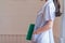 A uniformed female doctor stands by a window in her office holding a clipboard showing the patient`s examination and diagnosis