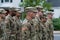 Uniformed soldiers in USA army diverse colors men walk in formation