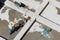 Uniformed workers clean sand on a construction site, top view