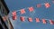 Union Jack flags flying from houses in the streets of Britain