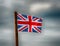 Union Jack with gathering storms clouds behind