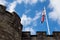 Union jack lifted above sterling castle`s fortifications on a su