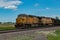 Union Pacific lashup with locomotives 6814 and 5468 smokes and steams westbound with empty coal hoppers