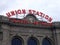 Union Station Sign Travel by Train sign and clock on top of building