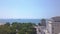Unique aerial panoramic drone revealing shot of iconic white tower in Thessaloniki,