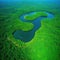 Unique aerial view of a winding river cutting through a vibrant green save the planet Enviroment