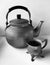 An unique andantique teapot and cup &# black and white &#