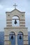 Unique bell tower of an orthodox church with three bells in Albania