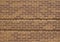 Unique brown color brick wall texture with with some rows of  protruding bricks
