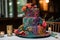 unique cake with intricate and colorful design, featuring the bride and groom's names