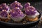 Unique cupcakes made of purple cream for fat thursday