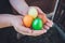 Unique hand painted Easter eggs in basket on grass.