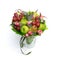 Unique handmade edible gift in the form of a bouquet of fruit standing in glass vase on a white background