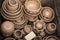 Unique handmade pots and dishes of clay before firing and reducing process in wood fire kiln.