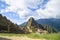 A unique and interesting view of the ancient Inca site of Machu Picchu, nestled high in the Andes Mountains of Peru