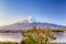 Unique Japan Travel Destinations. Recognizable Fuji Mountain At Kawaguchiko Lake in Japan.With  Tangerine Tree in Foregound.